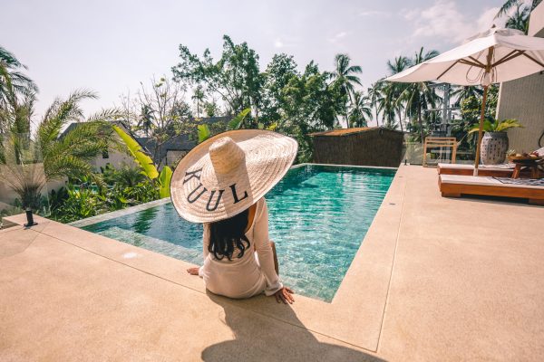 Spending time by a private villa pool, where calm and comfort come naturally.