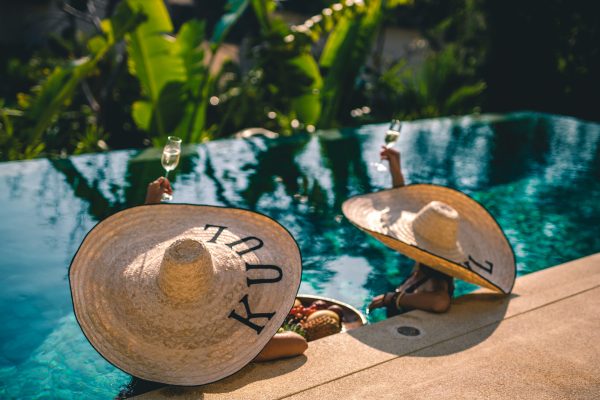 Enjoying the calm of a private villa pool, where luxury feels effortless and time slows down.