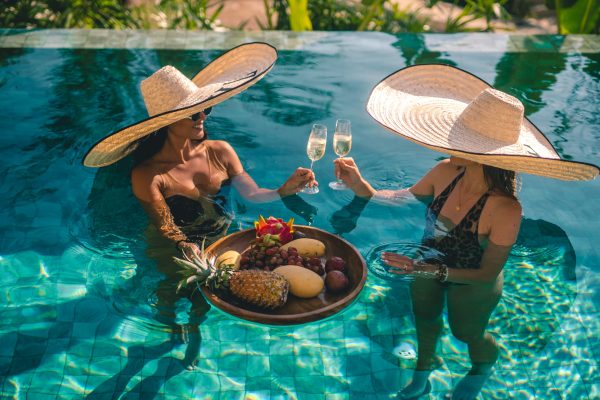 Relaxing by a private pool, surrounded by warmth, silence, and refined comfort.